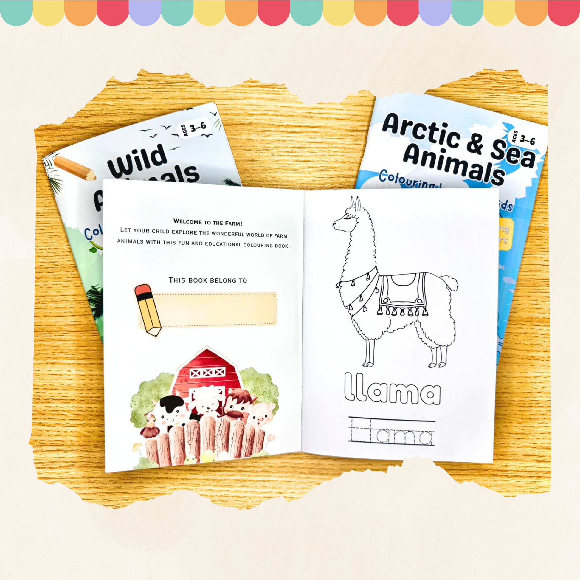 Coloring books on a wooden surface with a llama illustration and text.